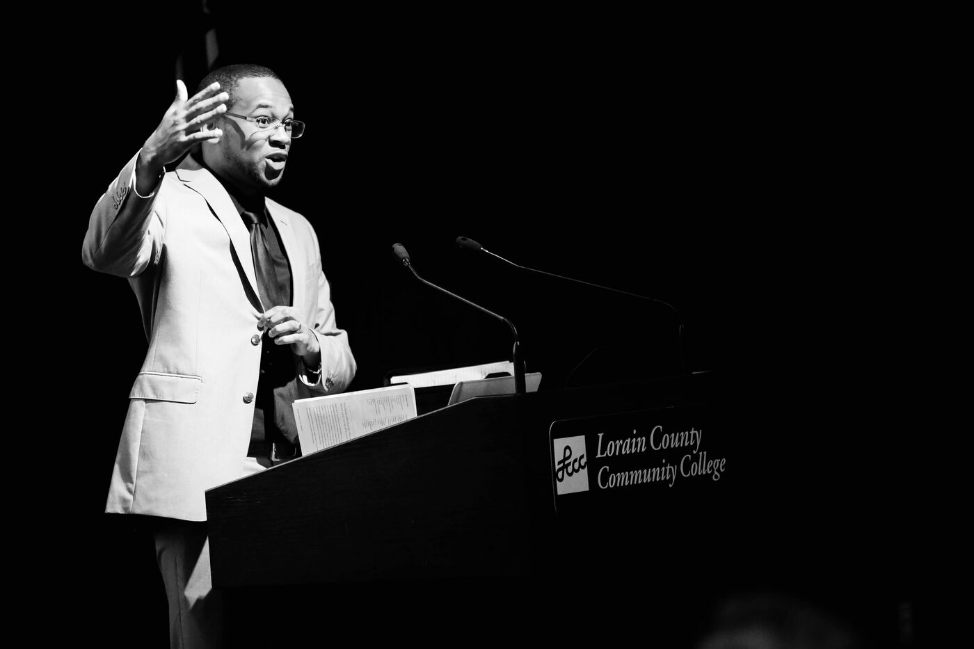 Frank Whitfield speaking from the podium at Lorain County Community College